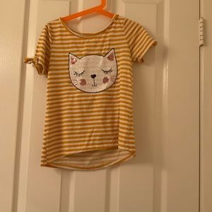 Yellow and white shirt.